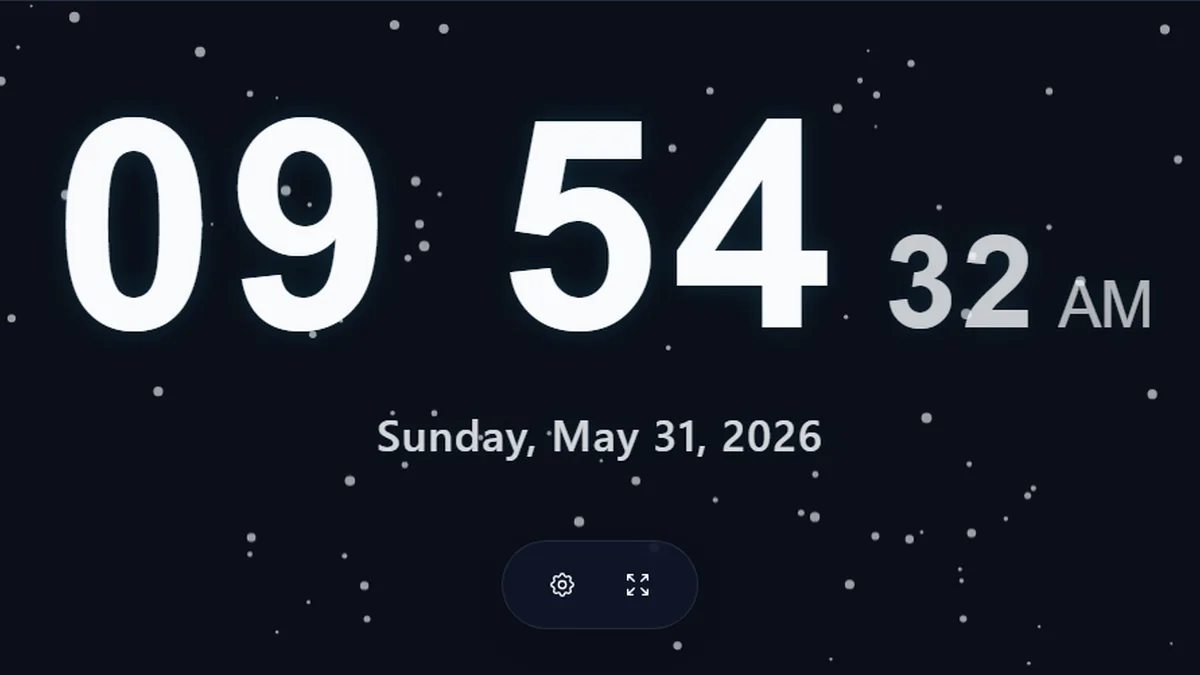 Fullscreen digital clock online with seconds and date display on a dark ambient background